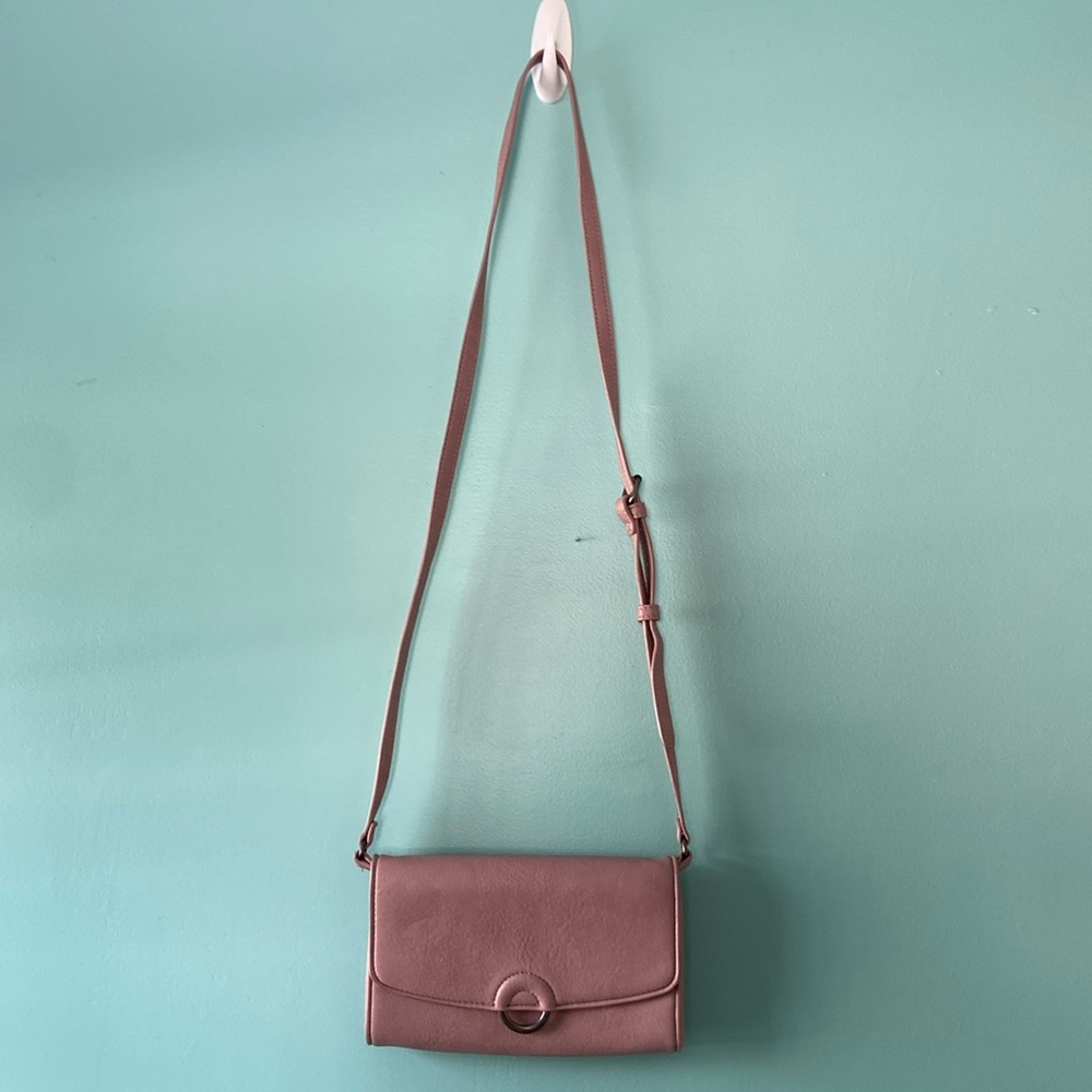 Pink crossbody bag. Fits phone, 4 card pouches, money pouch, small zipper pouch
